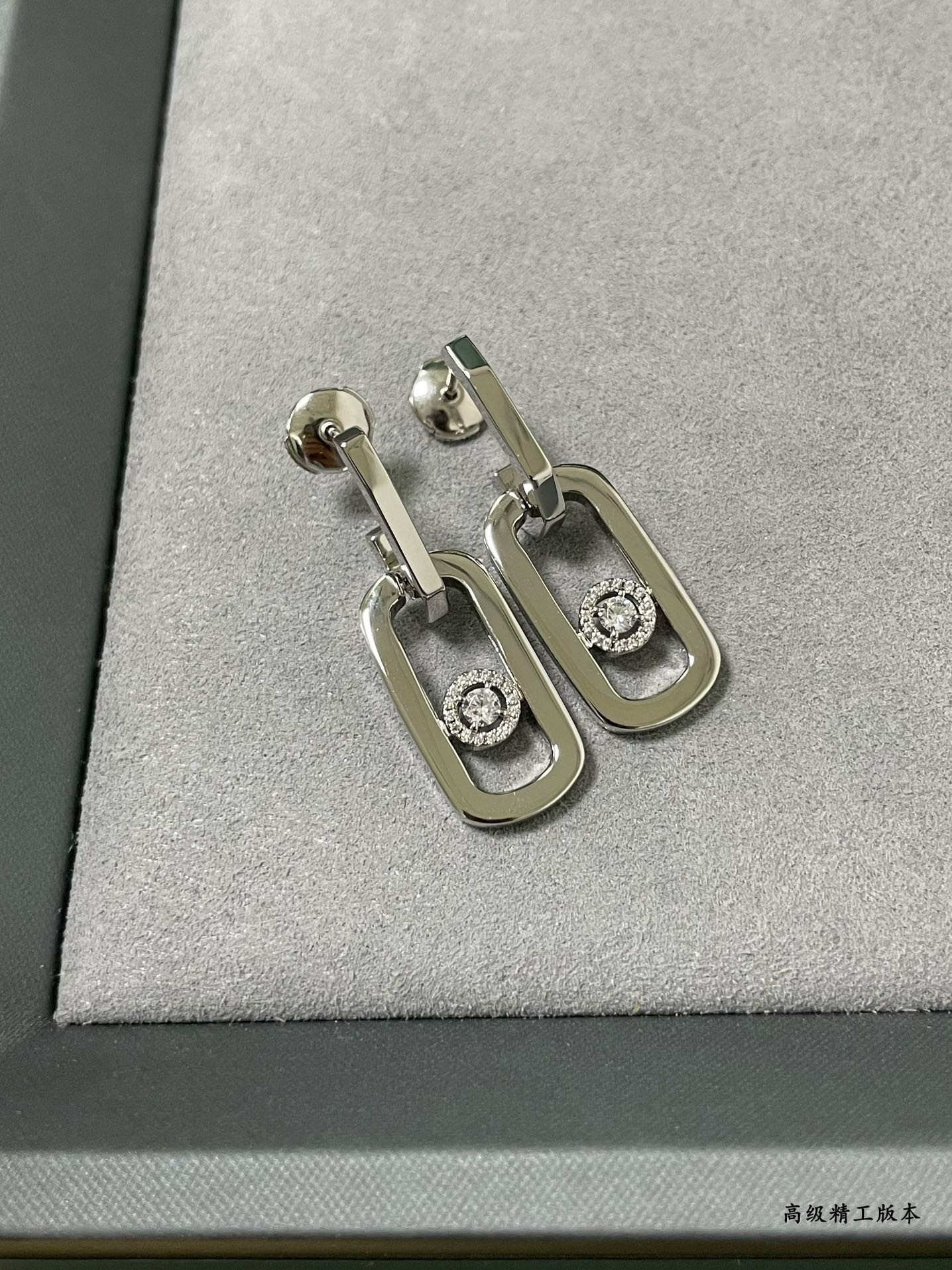 messika large single Di*m*nd moving stud earrings