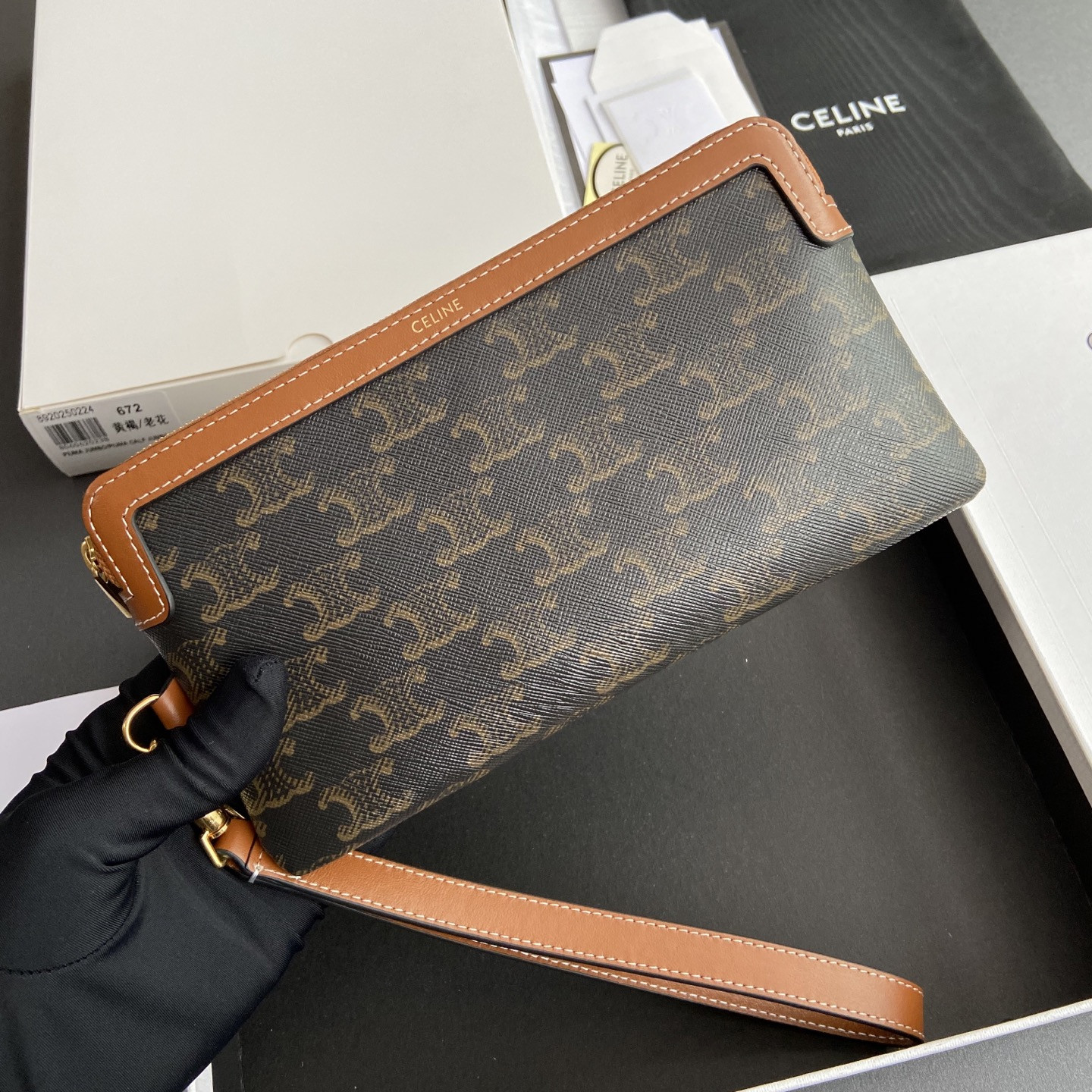 Ce**e long pouch with strap in triomphe canvas and calfskin 21.5x11.5x1cm