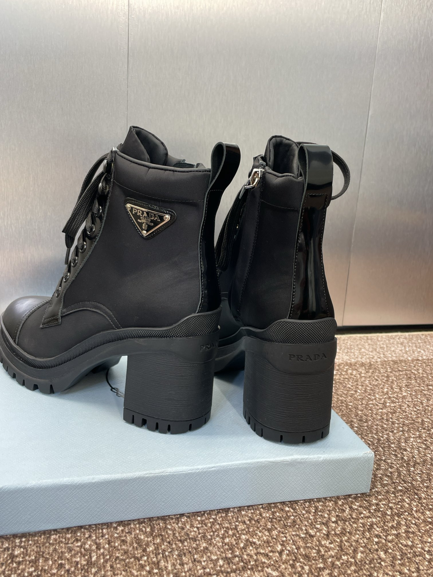 ua Pra*a re-nylon and leather booties